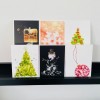 Salty – Set aus 6 Postkarten mit „herzhaften“  
weihnachtlichen Motiven von Max Faber