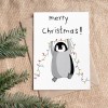 The Naughty District - Weihnachtskarte »Pinguin mit Lichterkette«