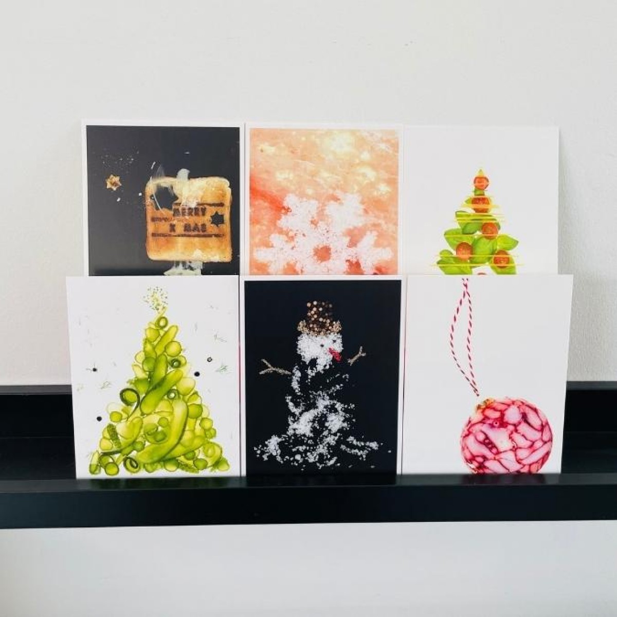 Salty – Set aus 6 Postkarten mit „herzhaften“  
weihnachtlichen Motiven von Max Faber