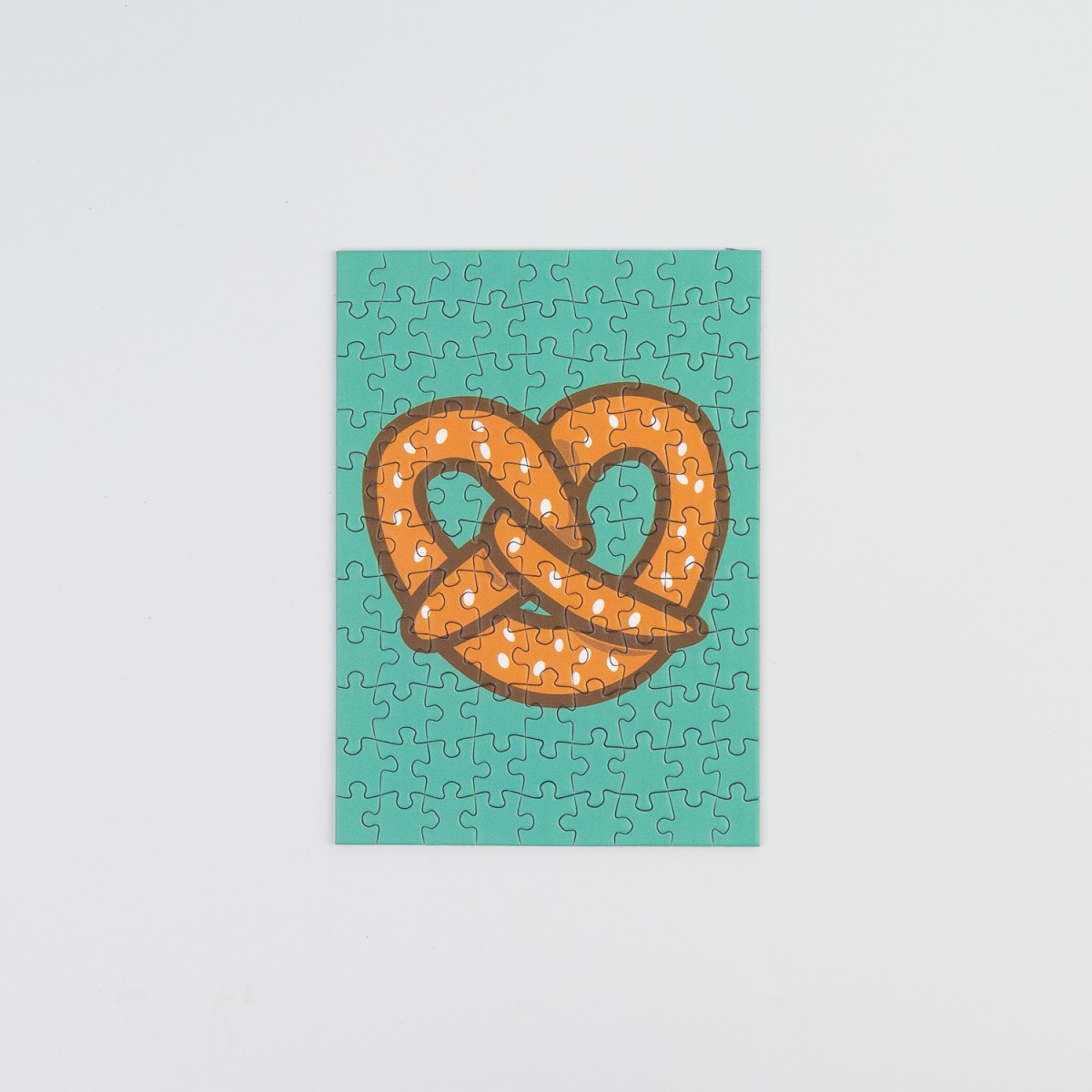 Sunshine Puzzles, Die Brezel, 99 Teile Mini Puzzle