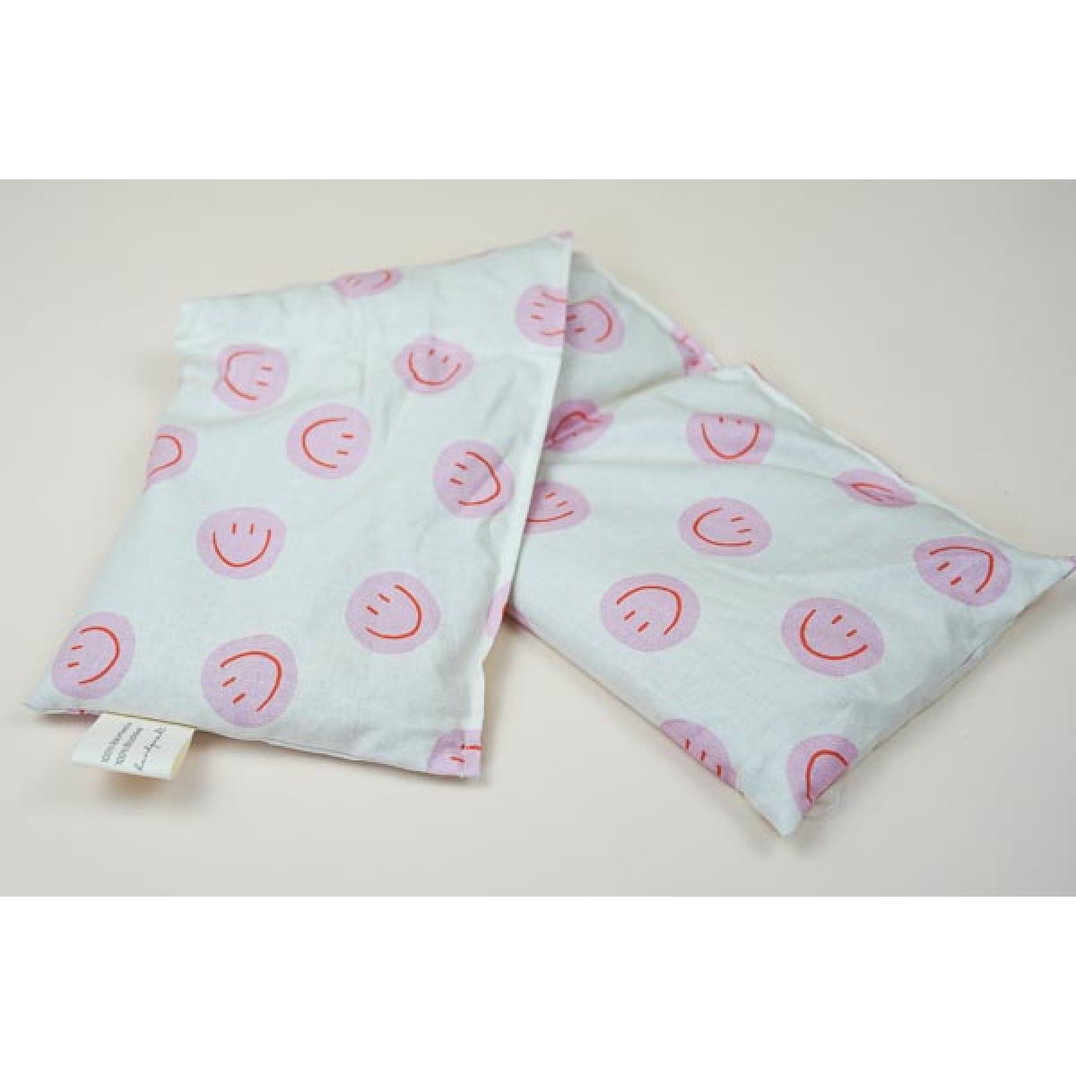 Dinkel Wärmekissen "Smiley Pink" – Körnerkissen zum Erhitzen aus Baumwolle und Bio-Dinkel - Tochter von Walter