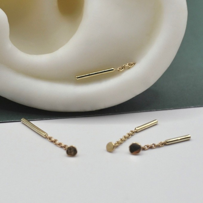 Ohrring "Eingefädelt" aus Gold von DOPPELLUDWIG