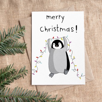 The Naughty District - Weihnachtskarte »Pinguin mit Lichterkette«
